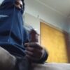 Horny black college dude rubbing his huge cock