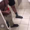 Group of horny guys stroking their cock in public toilet