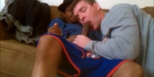 White horny stud sucking off a huge black cock on his sofa