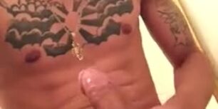 Young lightskin tattooed guy rubbing his cock in the toilet