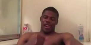 Black dude rubbing his huge long cock