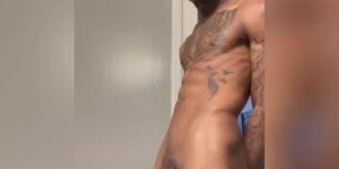 Cute muscled black shows off his huge hard erect cock spitting cum