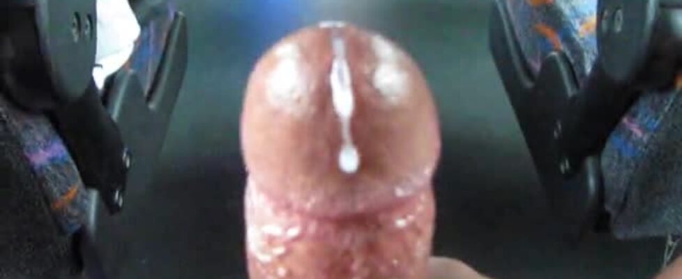 Black dude rubbing his huge cock at a public buss and shooting a huge load