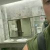 Handsome hung rubbing his cock in a public bathroom
