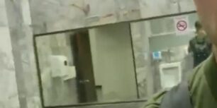 Handsome hung rubbing his cock in a public bathroom