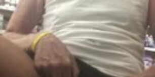 Mature guy rubbing his cock in the farmacy