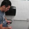 Caught a handsome guy stroking his cock in the toilet